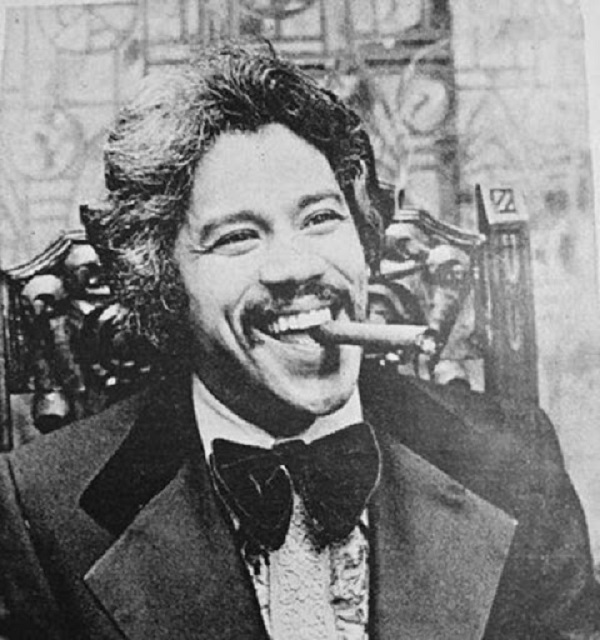 Johnny Pacheco smiling with a tobacco