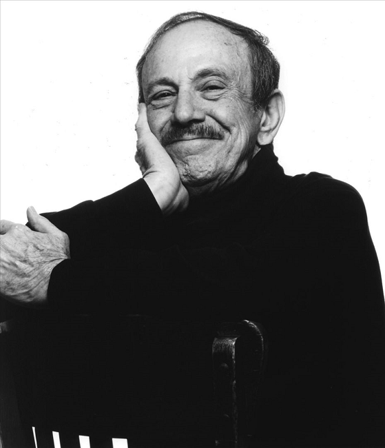 Arturo "Chico" O'Farrill seated and in black and white