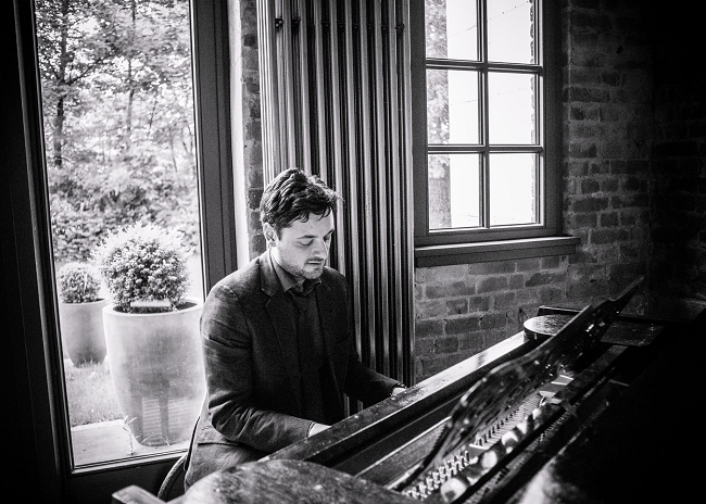 Fadi Gaziri in black and white playing the piano