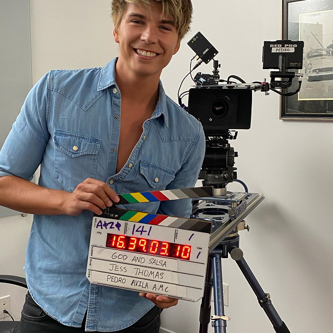Javier Luna with a blue shirt with the clapperboard in his hand